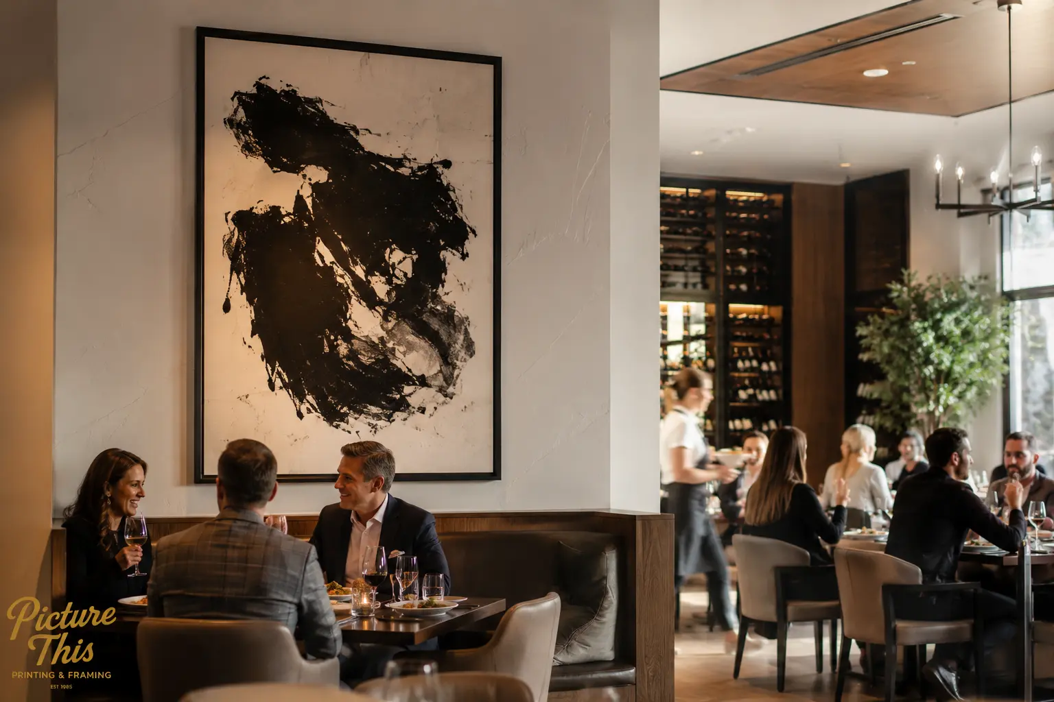 Large abstract artwork in a fine dining restaurant with guests enjoying dinner