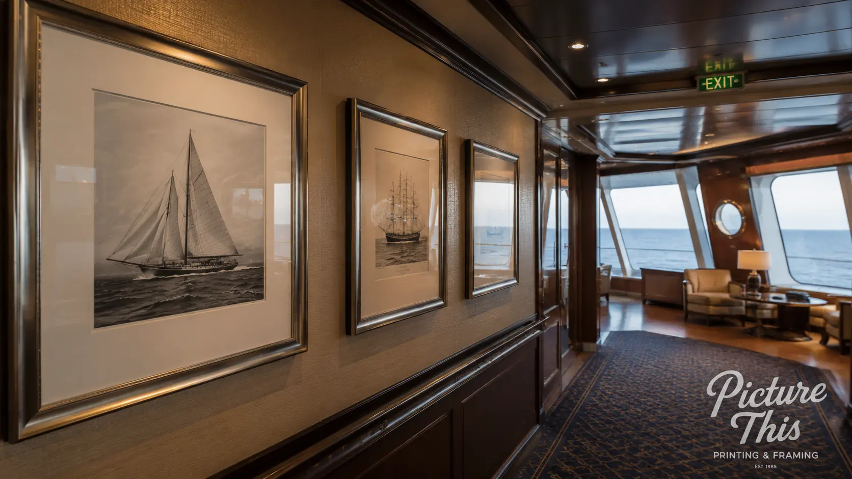 Custom framed artwork installed in a cruise ship corridor